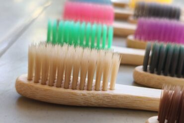 Pack of 10 Biodegradable Bamboo Toothbrush Family Pack (10-Pack) with Color Bristles, Individually Packed, and 2 Bamboo Tongue Cleaners – Natural Oral Care Set